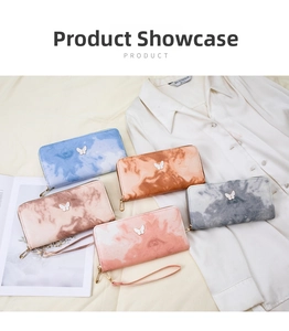 Detailed flat lay of gradient marble PU leather zip wallets with metal butterfly decor