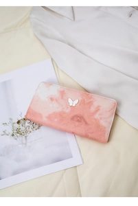Detail of pink marble gradient clutch wallet with elegant white butterfly metal clasp