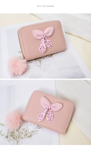 Pink mini coin purse with polka dot bow detail and soft faux fur pom-pom charm