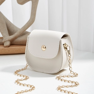 White saddle mini crossbody bag with litchi texture, gold hardware and chain strap