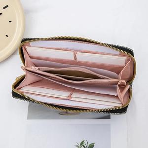 Long tweed wallet with sequin decor showing pink interior compartments and card slots