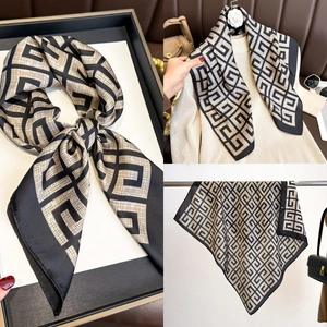 Detailed views of geometric G-pattern silk scarf showing styling and fabric texture