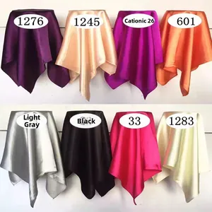 Detailed close-up of glossy satin fabric samples in multiple candy colors for square scarves