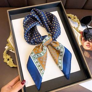 French retro blue and orange plaid silk scarf styled in an elegant necktie knot