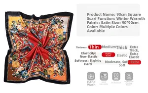 Detail view of 90x90cm paisley satin scarf showing fabric texture and material specs