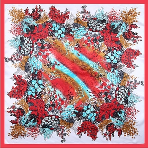 Detail view of 90cm satin square scarf with colorful tulip floral prints and red borders