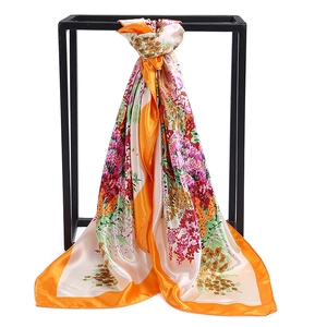 Floral print satin square scarf with bright orange border and silky finish for women