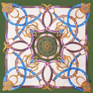 Detailed flat lay of a silk scarf with retro chain, belt buckle, and horse bit patterns