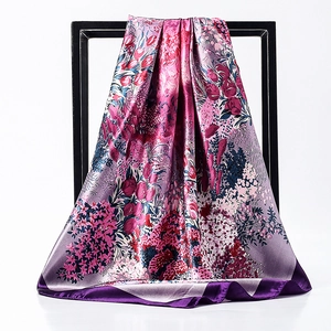 Floral print 90cm satin square scarf with purple and pink blossoms on a modern display