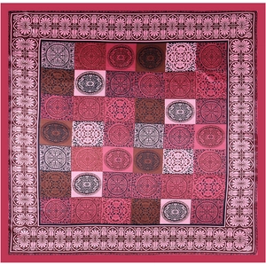 Flat lay of a large square satin scarf with vintage ethnic circular patterns in deep red