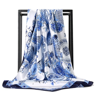 Blue and white porcelain style silk scarf with classical floral patterns on white background