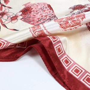 Detailed macro view of Chinese silk scarf featuring classic porcelain floral patterns