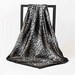 Luxurious leopard print satin square scarf in silver and black with elegant drape
