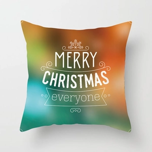 Detail of Christmas pillowcase with Merry Christmas text on colorful bokeh background