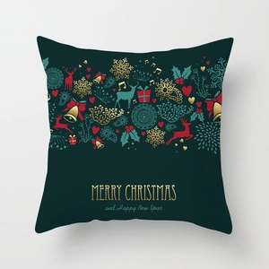 Detail of green Christmas pillowcase with gold reindeer patterns and festive holiday slogans