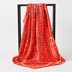 Red 90cm square silk scarf featuring luxury gold chain patterns and Paris print design