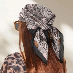 Bohemian paisley print satin square scarf worn as headwrap for elegant styling
