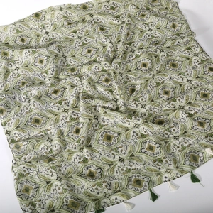 Detail of paisley voile scarf with fringe trim in light beige and green floral pattern