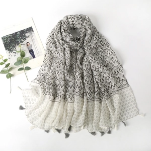 Elegant long cotton scarf with geometric wave and heart prints featuring tassel edges