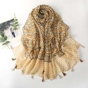 Bohemian style fringe scarf with geometric and heart patterns in mustard yellow and beige