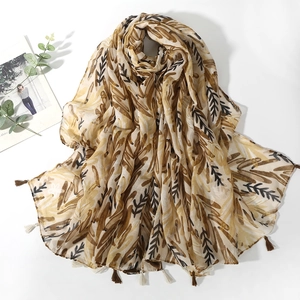 Bohemian printed leaf scarf with fringe tassels in warm ginger and brown tones