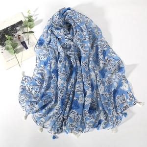 Blue heart print scarf with decorative tassels and a soft aesthetic flat lay design