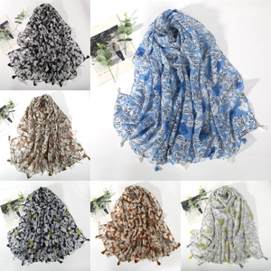 Detail showing six assorted lightweight heart print scarves with elegant tassel fringe