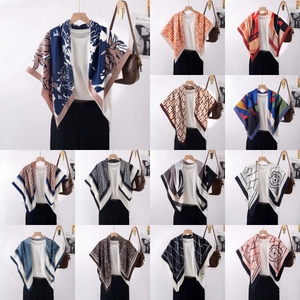 Detailed grid showing 12 silk scarf styles with zebra and geometric patterns on hangers