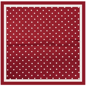 Détail du foulard en soie à pois rouges et blancs avec bordure contrastée élégante