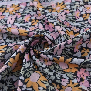 Floral print bali yarn headscarf with orange and pink flowers on dark blue base