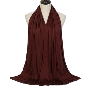 Solid burgundy jersey scarf in mercerized cotton shown draped on a mannequin