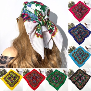 Detailed multi-color display of ethnic floral print square headscarves with gold thread