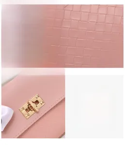 Close-up of pink woven texture PU leather handbag with golden metal turn-lock detail