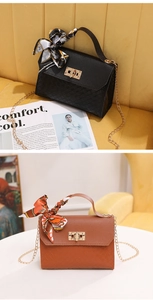Close-up of PU leather handbags with diamond lattice pattern and silk scarf handle detail