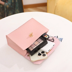 Pink woven PU leather handbag with gold twist lock showing spacious interior storage