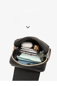 Internal capacity display of the black crossbody bag with phone, makeup and accessories