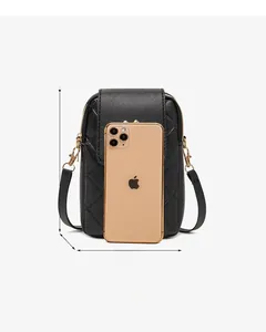 Detail view of black quilted crossbody phone bag with dimensions 18cm x 12cm x 4cm