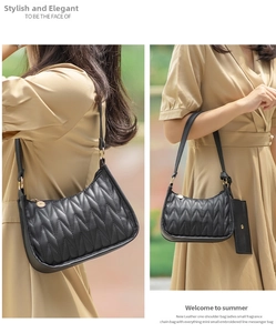 Quilted black underarm bag with gold metal hardware and detachable small card pouch