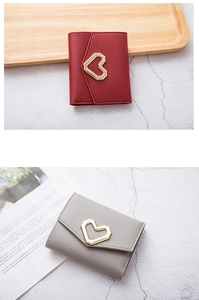 Detalle de carteras cortas para mujer con hebillas de corazón en cuero PU rojo y gris