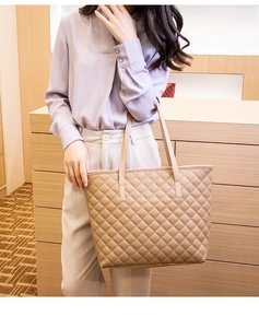 Chic quilted tote bag in beige PU leather with elegant diamond stitching and long handles