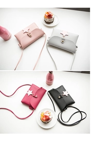Detail of mini crossbody bags with star pendants and textured faux leather in various colors