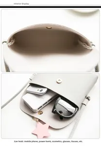 Detalle del interior del bolso bandolera gris con un colgante de estrella rosa suave