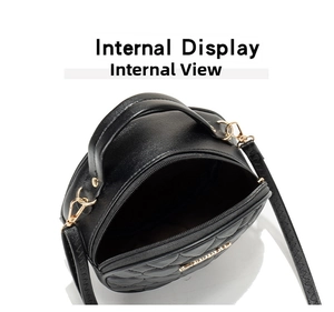 Detail of the internal display showing capacity and gold hardware of the heart quilted bag