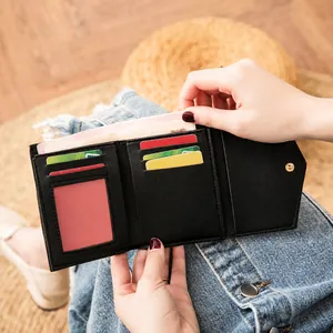 Black pebbled leather tri-fold short wallet for women featuring multiple card slots