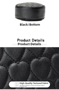 Detailed bottom view of black heart-quilted leather bag showing premium texture and finish