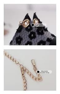 Détails de broderie en dentelle noire avec bandoulière réglable en chaîne dorée sur le sac
