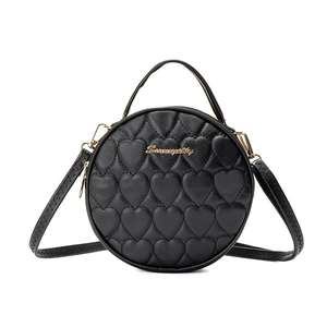 Retro black heart quilted round handbag with gold Sunnycity logo and adjustable strap