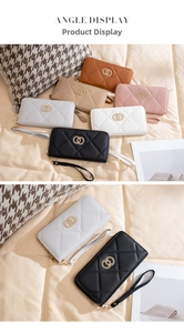 Detail view of quilted long wallets with double zippers and metal chain accents in multiple colors