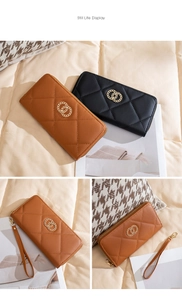 Detail of long quilted wallets in brown and black with gold ring logo and wrist straps