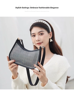 Detail of shell-shaped hobo bag with rhinestone patterns and adjustable strap worn by model